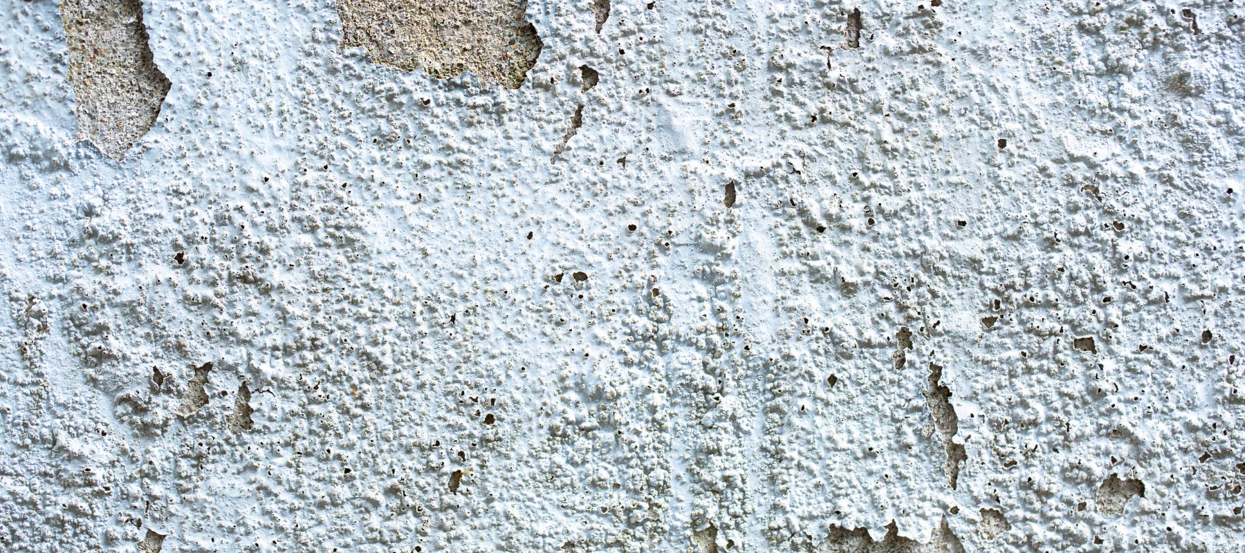 white bubbling and blistering paint on a texas home