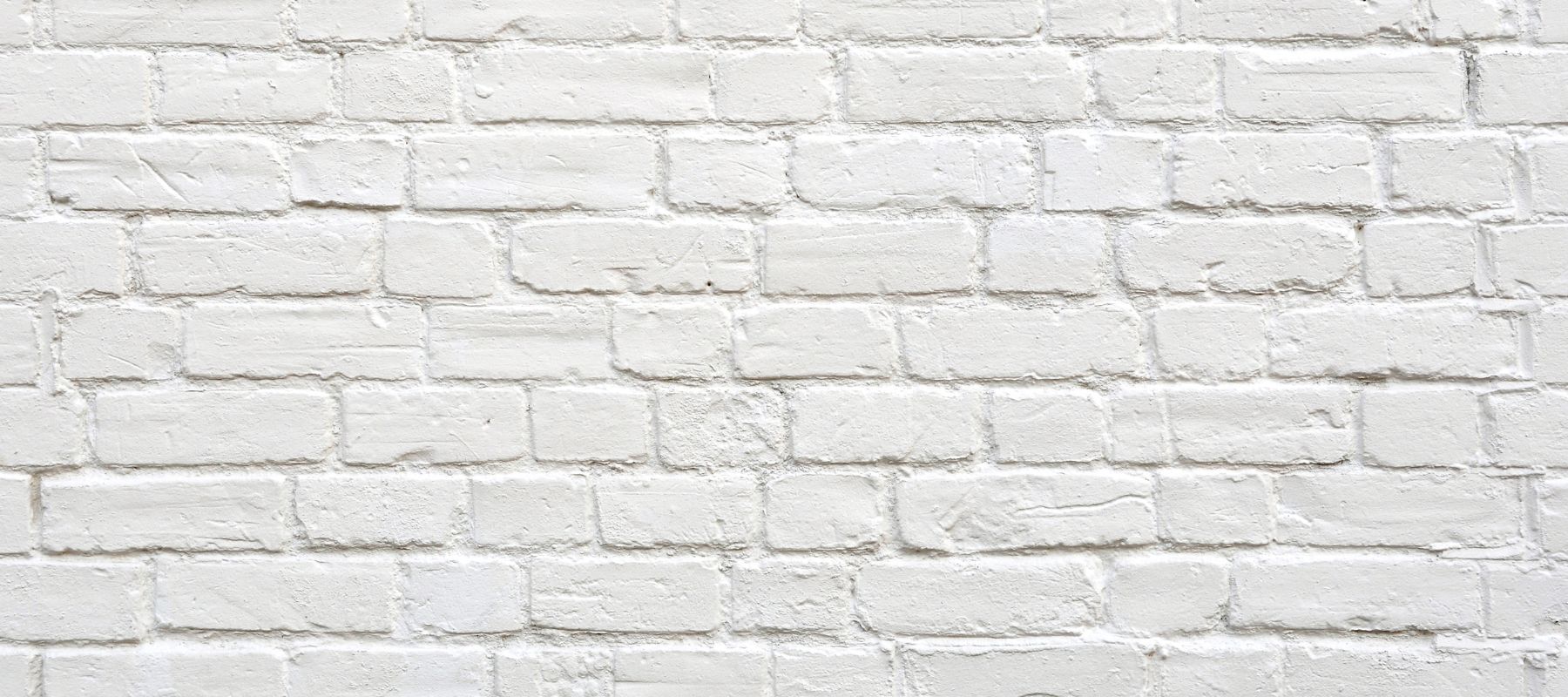 white paint on a brick wall
