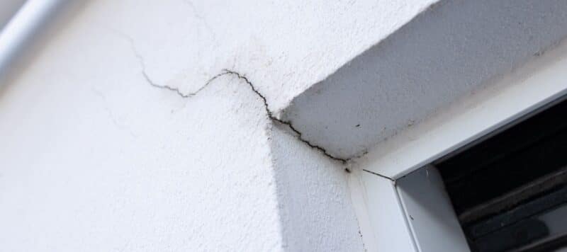 large crack in stucco exterior