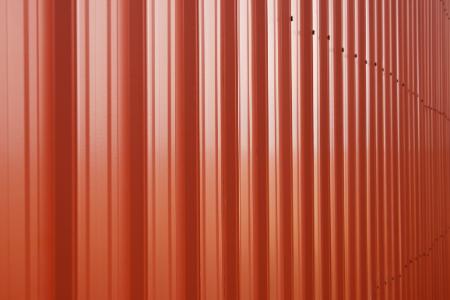 Aluminum siding painted in orange.